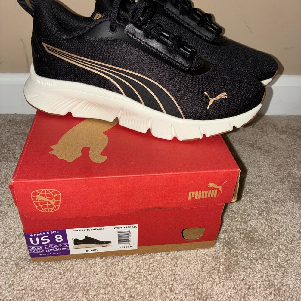 Puma Black and Gold Athletic Shoes